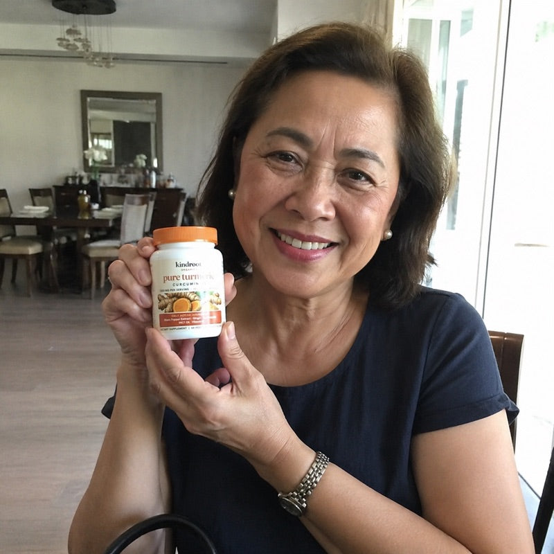 KindRoot customer holding Pure Turmeric Curcumin 95